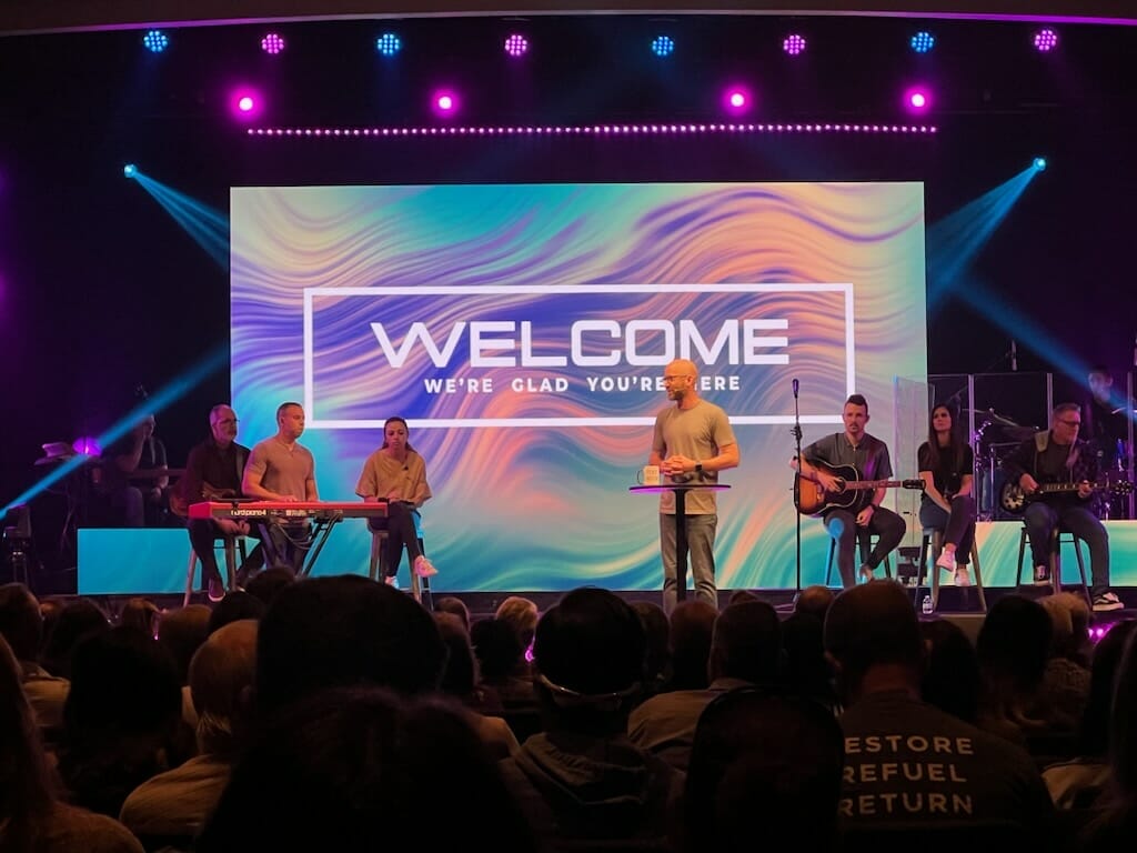 A single-focus LED display centered on a church stage design